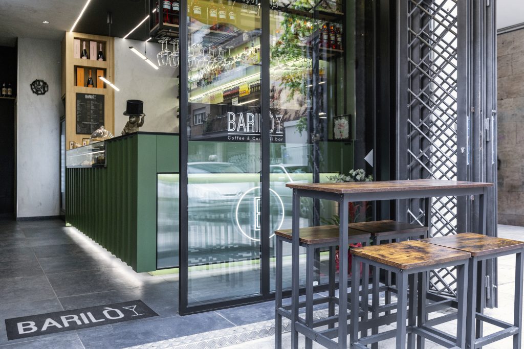 entrance to an industrial style cocktail bar
