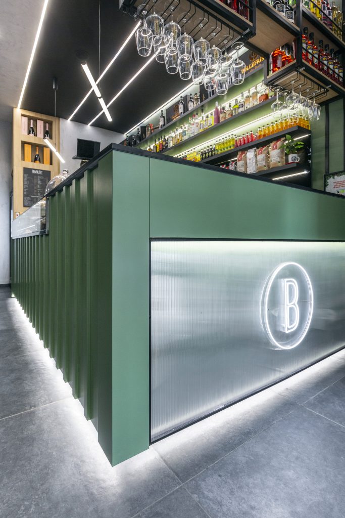 detail of green industrial style cocktail bar counter